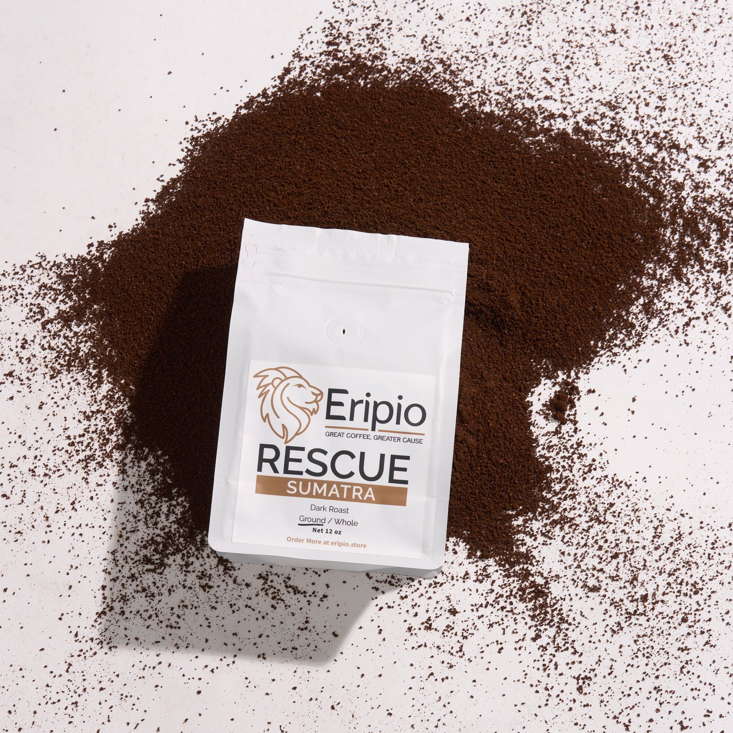 Eripio Rescue coffee packaging surrounded by ground coffee on a light background